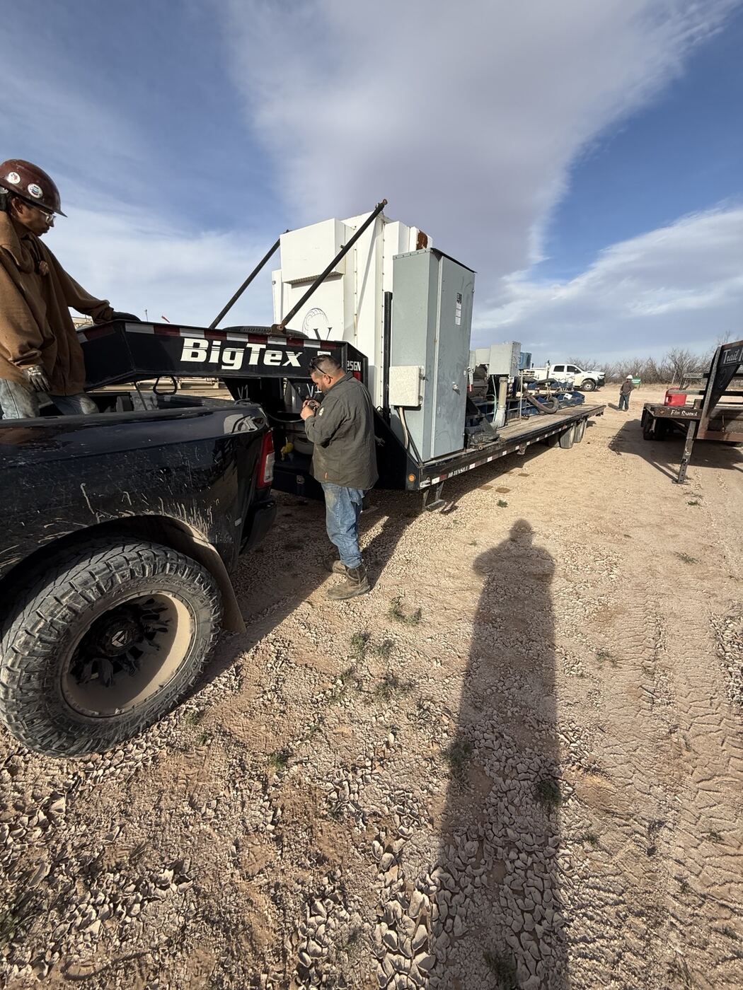 Tiburon Services team moving equipment at an oilfield location